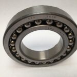SRO 1214 double row self-aligning ball bearing, 70mm ID x 125mm OD x 24mm Width, with stamped steel cage. Accommodates angular misalignment, 5300 rpm limit, ideal for simple mounting in industrial machines globally.
