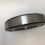SRO 1214 double row self-aligning ball bearing, 70mm ID x 125mm OD x 24mm Width, with stamped steel cage. Accommodates angular misalignment, 5300 rpm limit, ideal for simple mounting in industrial machines globally.