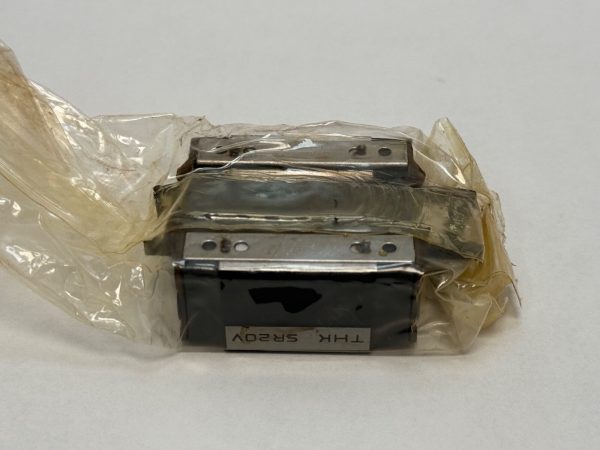 THK SR20V1UU Linear Motion Rolling Guide Block. Compact heavy load capacity LM block with 20mm rail width and 26mm width. Uses 4 rows of steel balls for smooth, low-friction movement in high-precision machinery.