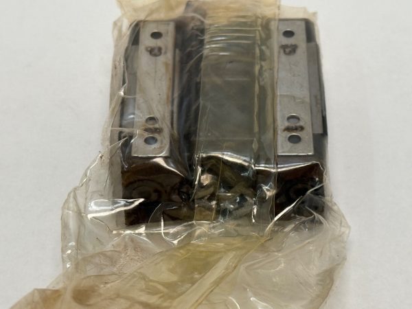 THK SR20V1UU Linear Motion Rolling Guide Block. Compact heavy load capacity LM block with 20mm rail width and 26mm width. Uses 4 rows of steel balls for smooth, low-friction movement in high-precision machinery.
