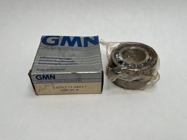 GMN S6206CTAA7DUM angular contact ball bearing, shrink-wrapped, beside its original labeled box