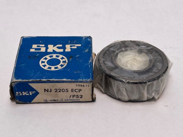 SKF NJ2205ECPP52 cylindrical roller bearing, shrink-wrapped, next to its SKF box