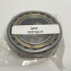 SKF 22210-CY spherical roller bearing, 50mm ID x 90mm OD x 23mm Width, featuring a standard stamped steel cage and straight bore. Handles heavy radial loads and misalignment, suited for equipment in the US.