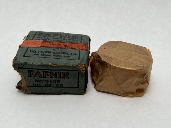 Fafnir MM9105WIDB bearing box labeled DB DF CR next to a wax-paper wrapped bearing