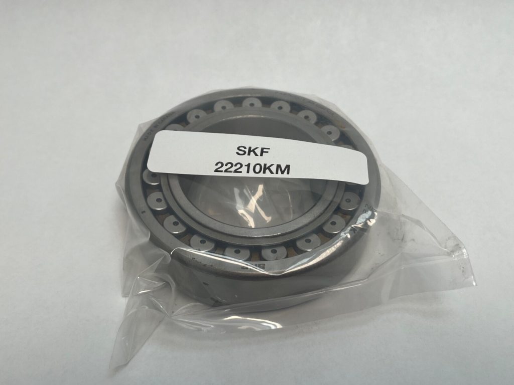 SKF 22210KM Spherical Roller Bearing 50x90x23mm. Tapered bore (1:12), machined brass cage (M). Extreme load capacity, self-aligning design.