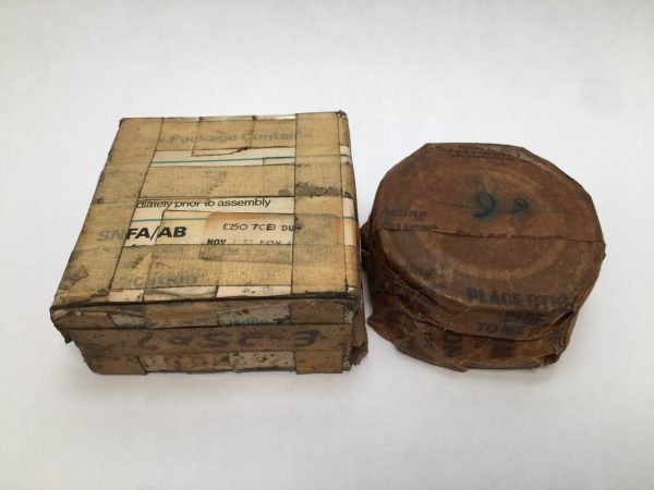 SNFA E250-7CE3DUM angular contact ball bearing in original wrapped packaging beside its box