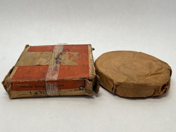 NDH 20215DTL3A angular contact ball bearing in original Delco New Departure box beside wax paper wrapping