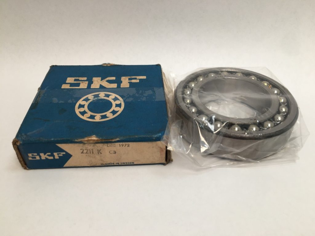 SKF 2211-K-C3 Self-Aligning Ball Bearing (55mm ID, 100mm OD, 25mm Width). Tapered bore and C3 clearance for adapter sleeve mounting in US industrial fans.