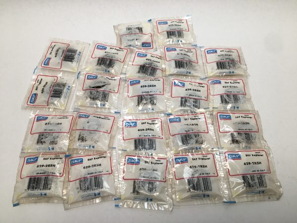 Multiple individually sealed SKF 629-2RSH bearing packets, made in Italy, laid out on a table