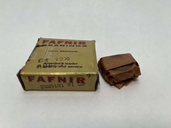 Fafnir 2MM9101WICR angular contact bearing box beside wrapped bearing in wax paper