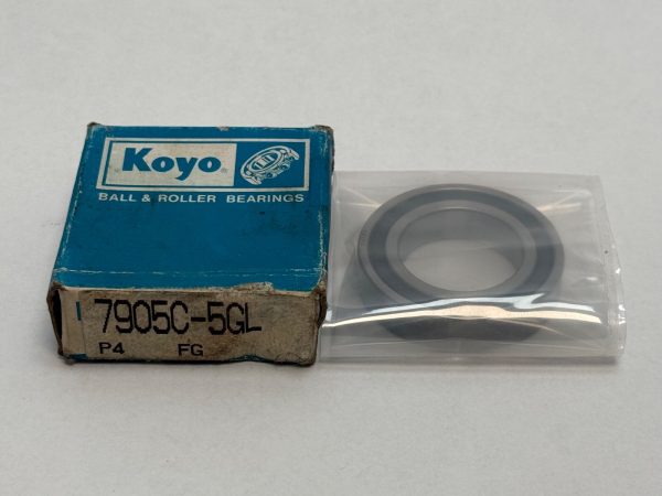 Koyo 7905C-5GL P4 FG angular contact ball bearing in plastic sleeve next to its Koyo box