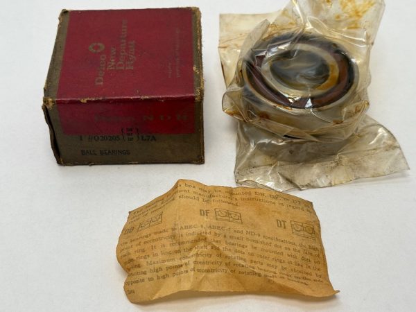 NDH Q20205DTL7A angular contact ball bearing in plastic wrap next to its original Delco New Departure box and instructions