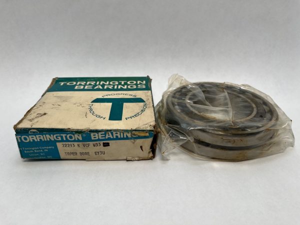 Torrington 22213KVCFW33C3 spherical roller bearing, taper bore, shown in plastic wrap next to its original box