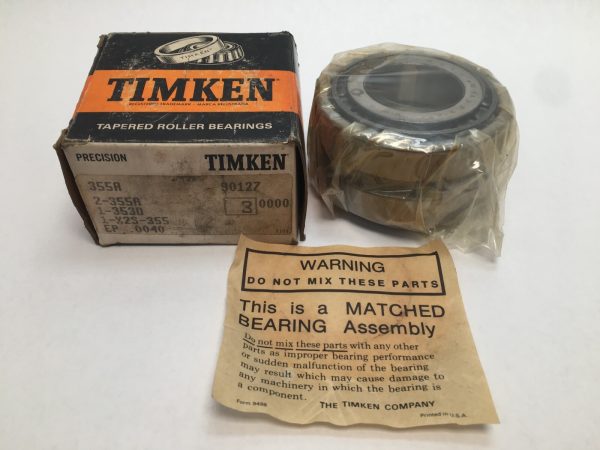 Timken 355A-90127 tapered roller bearing in plastic wrap next to its labeled box and matched-assembly warning slip