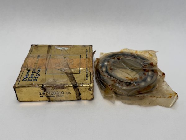 NDH N20210 angular contact flange bearing in plastic wrap next to its original New Departure Hyatt box