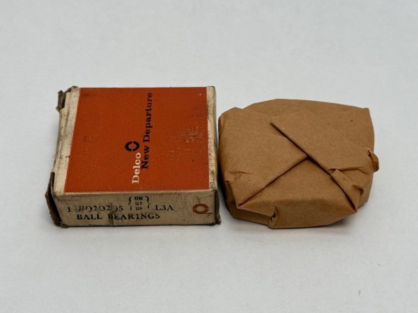 NDH Q20205DTL3A angular contact ball bearing in original Delco New Departure box beside wrapped unit
