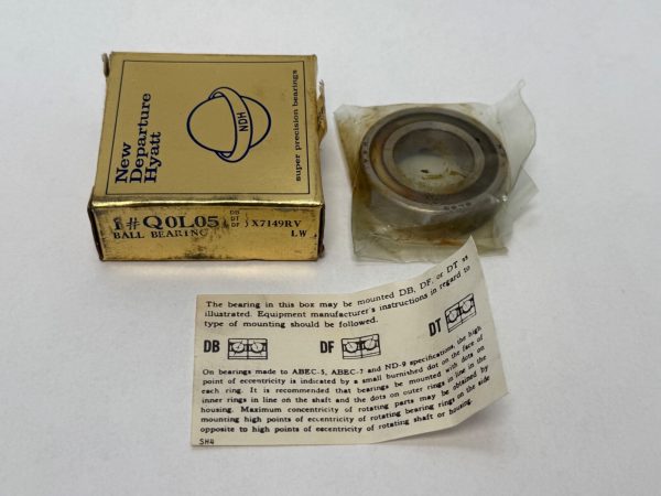 NDH Q0L05DT angular contact ball bearing next to its New Departure Hyatt box and mounting instructions sheet