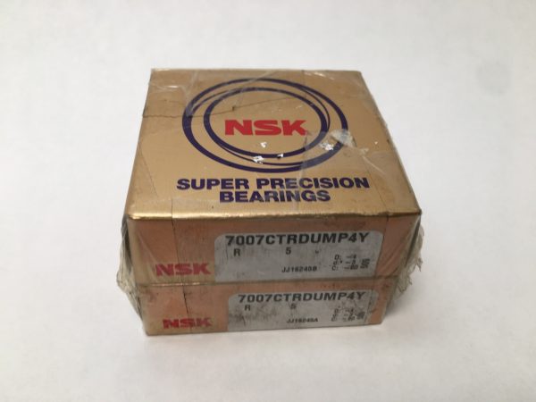 Two stacked NSK 7007CTRDUMP4Y Super Precision angular contact ball bearing boxes with labels