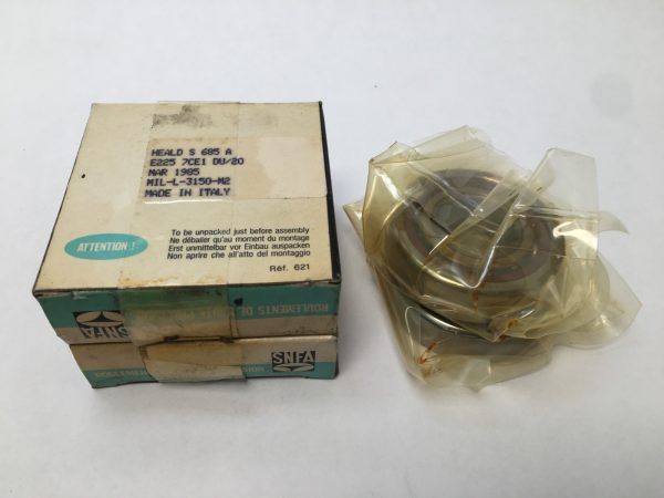 SNFA E225-7CE1DU angular contact ball bearing next to its original labeled box, wrapped in plastic