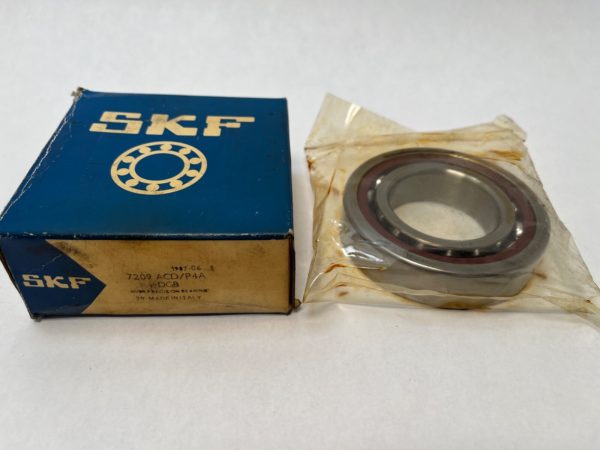 SKF 7209-ACD/P4A angular contact ball bearing next to its original SKF box