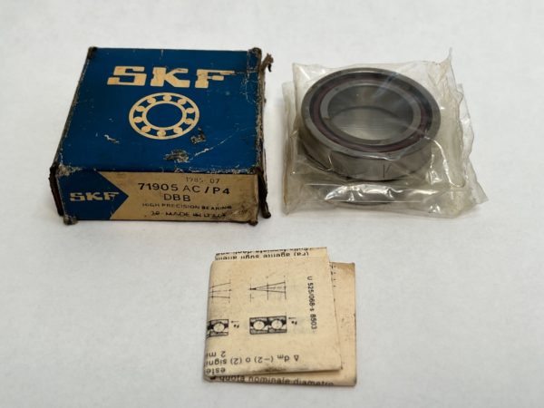 SKF 71905ACP4ADBB angular contact ball bearing in plastic wrap next to its original box and paper insert