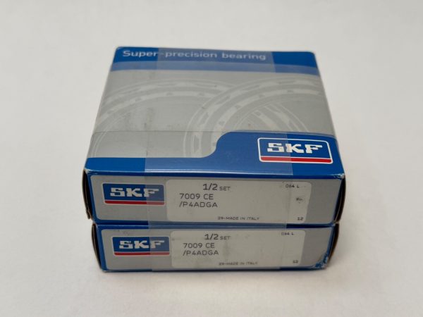Two stacked SKF boxes labeled 7009 CE/P4ADGA super-precision angular contact ball bearings, 1/2 set each