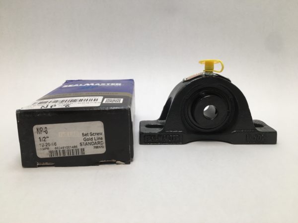 SealMaster NP8 cast iron pillow block bearing with 1/2" bore next to its original box
