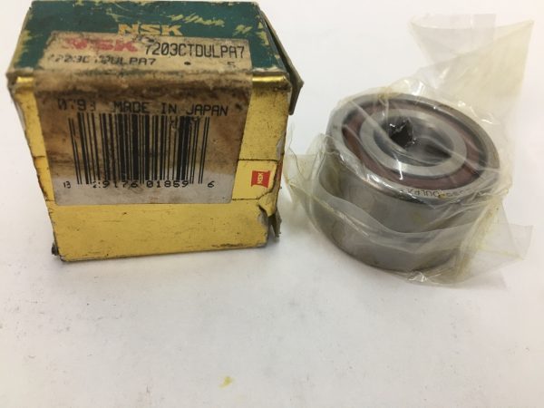 NSK 7203CTDULPA7 angular contact ball bearing in shrink wrap next to its original box