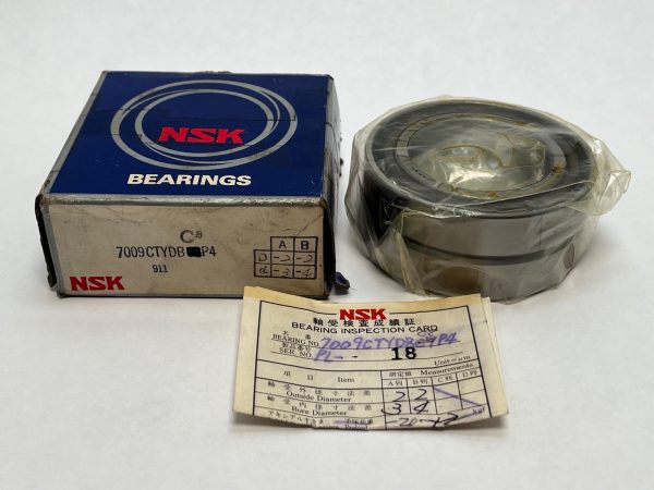 NSK 7009CTYDBC8P4 angular contact ball bearing, shrink-wrapped, beside its box and bearing inspection card