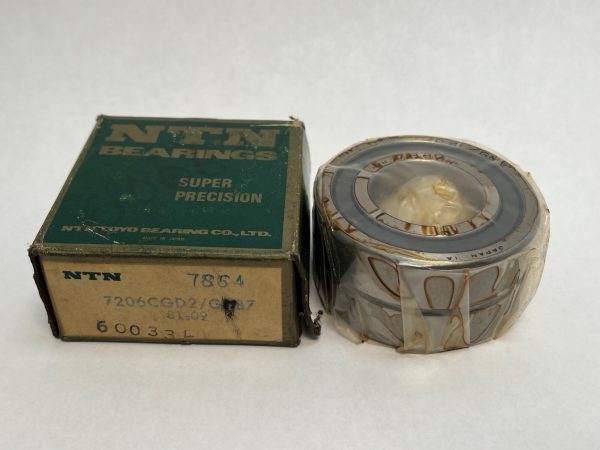 NTN 7206CGD2GMP4 angular contact ball bearing shown beside its original green NTN Super Precision box