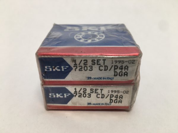 Two stacked SKF 7203 CD/P4A DGA angular contact bearing boxes labeled 1/2 Set, Made in Italy