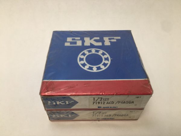 SKF 71912ACD/P4ADGA angular contact ball bearing, shown in two stacked sealed SKF boxes