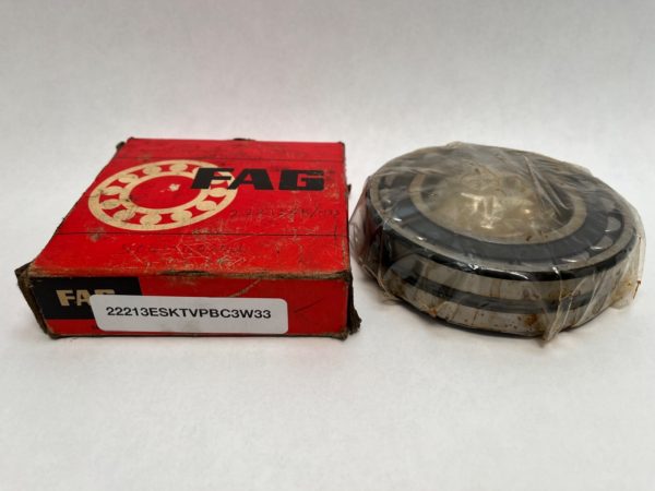 FAG 22213ESKTVPBC3W33 spherical roller bearing, shrink-wrapped, next to its red FAG box