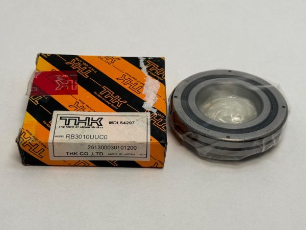 THK RB3010UUC0 crossed roller bearing, model MDL54297, shown beside its original THK box