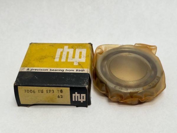 RHP 7006TSULP6 angular contact bearing wrapped in plastic beside its yellow and black RHP box