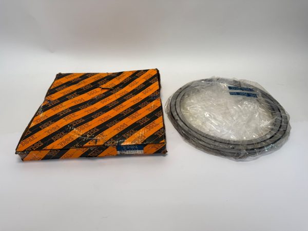 THK RB25025UU-C0 crossed roller bearing in plastic wrap next to its original striped THK packaging box