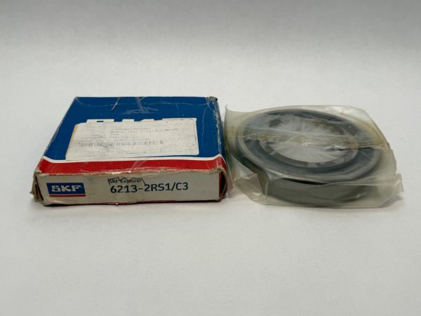 SKF 6213-2RS1/C3 rubber-sealed ball bearing next to its labeled SKF box