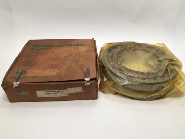 Torrington 22224CJW33C3 spherical roller bearing in plastic wrap next to its labeled Torrington-Fafnir box