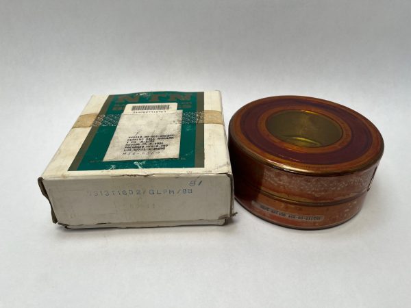 NTN 7313T1GD2GLPM angular contact ball bearing in a protective wrapper beside its original labeled box