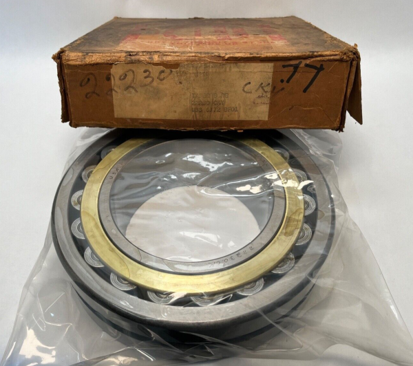 SKF 22230CKYW33 spherical roller bearing in plastic wrap, shown with original worn cardboard box