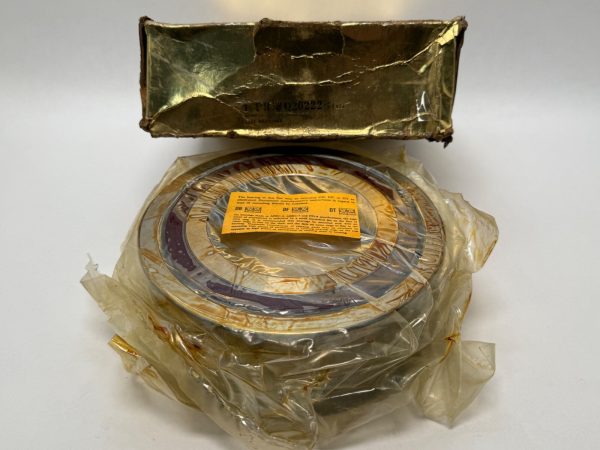 NDH Q20222DTX7A angular contact ball bearing wrapped in plastic beside its original box