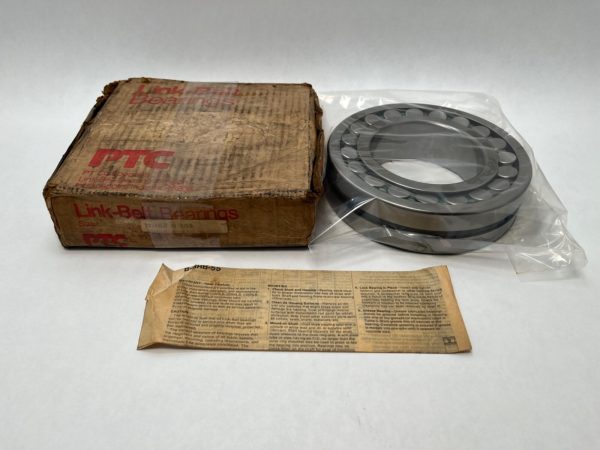 Rollway spherical roller bearing in plastic wrap next to its worn Link-Belt Bearings box and instruction sheet