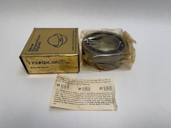 NDH Q0L10GDTS9A angular contact ball bearing in plastic wrap next to its New Departure Hyatt box and instruction sheet