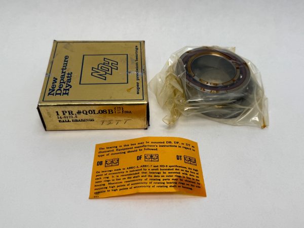 NDH Q0L08BDTS9A angular contact ball bearing in plastic wrap beside its New Departure Hyatt box and instruction sheet