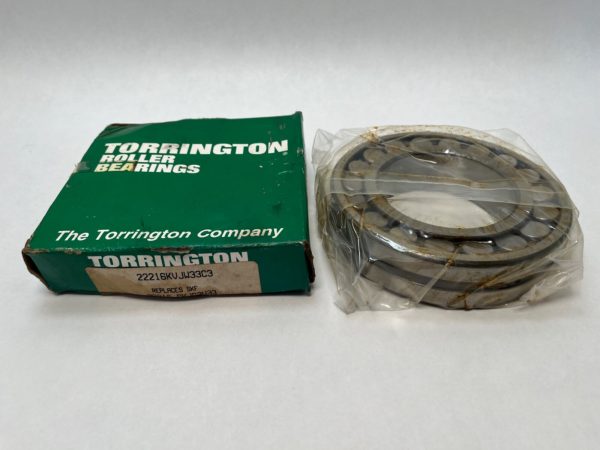 Torrington 22216KVJW33 spherical roller bearing, tapered bore, in plastic wrap next to its original box