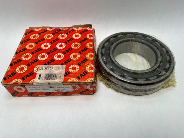 FAG 22219E1C5 spherical roller bearing, shrink-wrapped, next to its red FAG packaging box