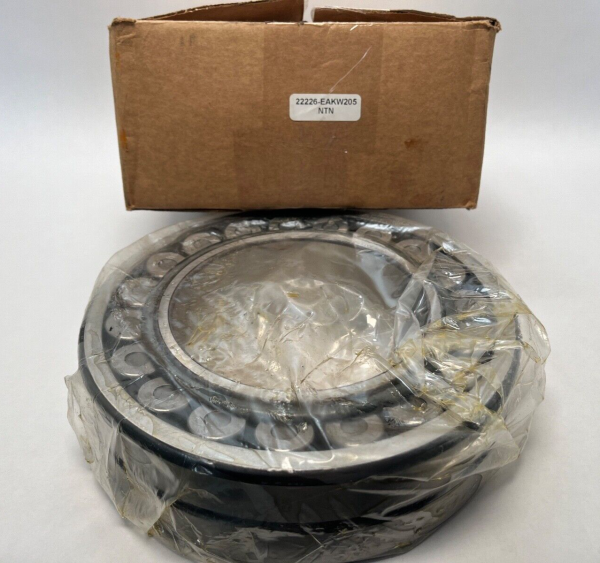 NTN 22226EAKW33 spherical roller bearing wrapped in plastic beside its labeled cardboard box