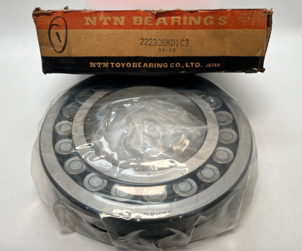 NTN 22230BKD1C3 spherical roller bearing, shrink-wrapped, in front of its original NTN Bearings box