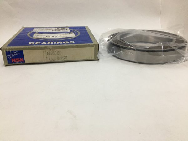 NSK 6026DDU deep groove ball bearing in plastic wrap next to its NSK bearings box