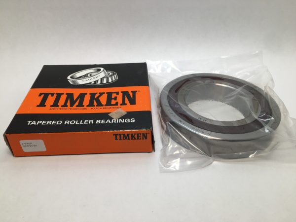 Fafnir MM220WI bearing in plastic packaging next to its Timken tapered roller bearings box